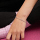 Cintilar sterling silver adjustable bracelet with pink in cross shape cover