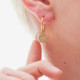 Astra gold-plated white charm earrings cover